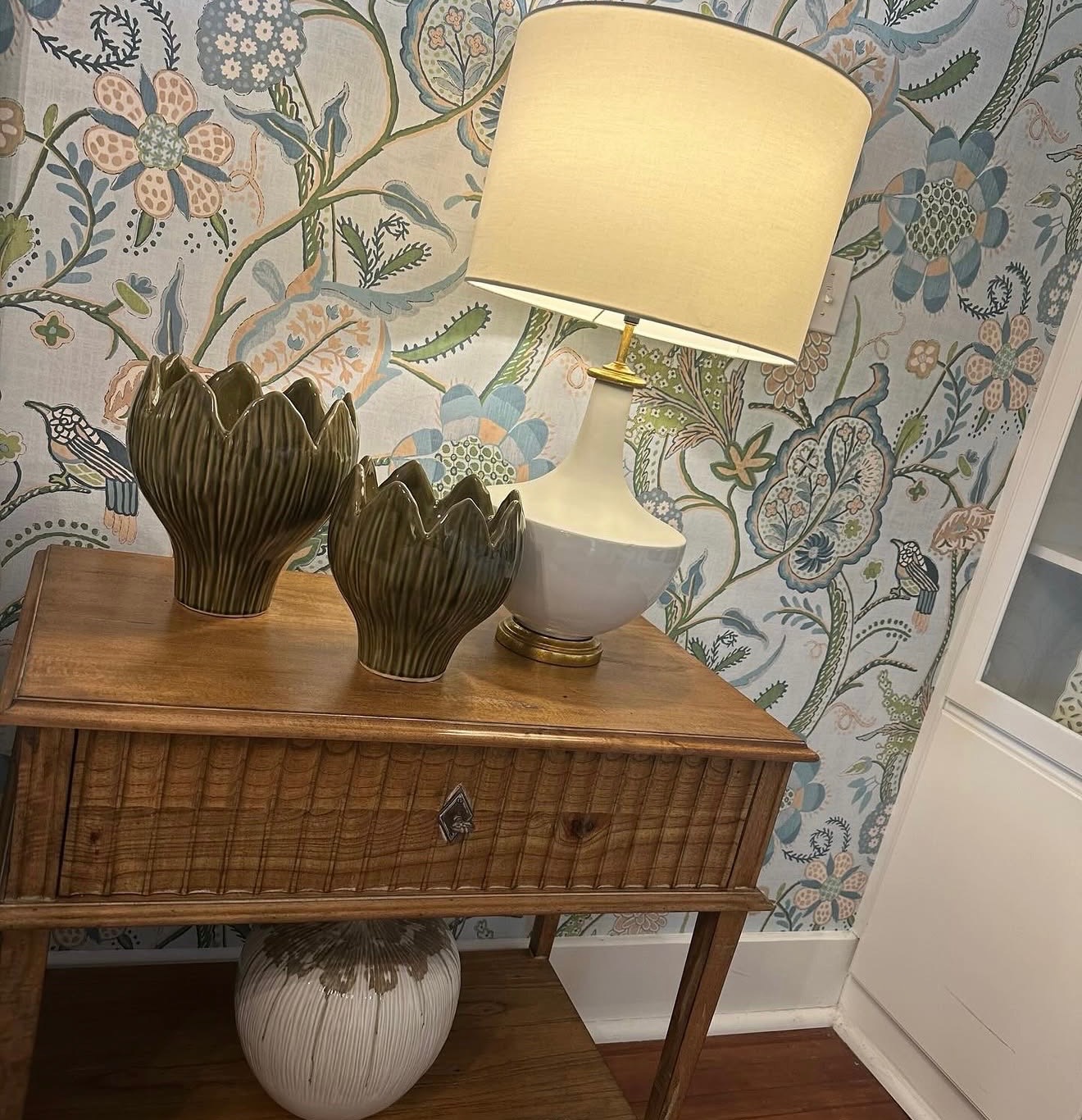 Botanical wallpaper vignette with artichoke vases